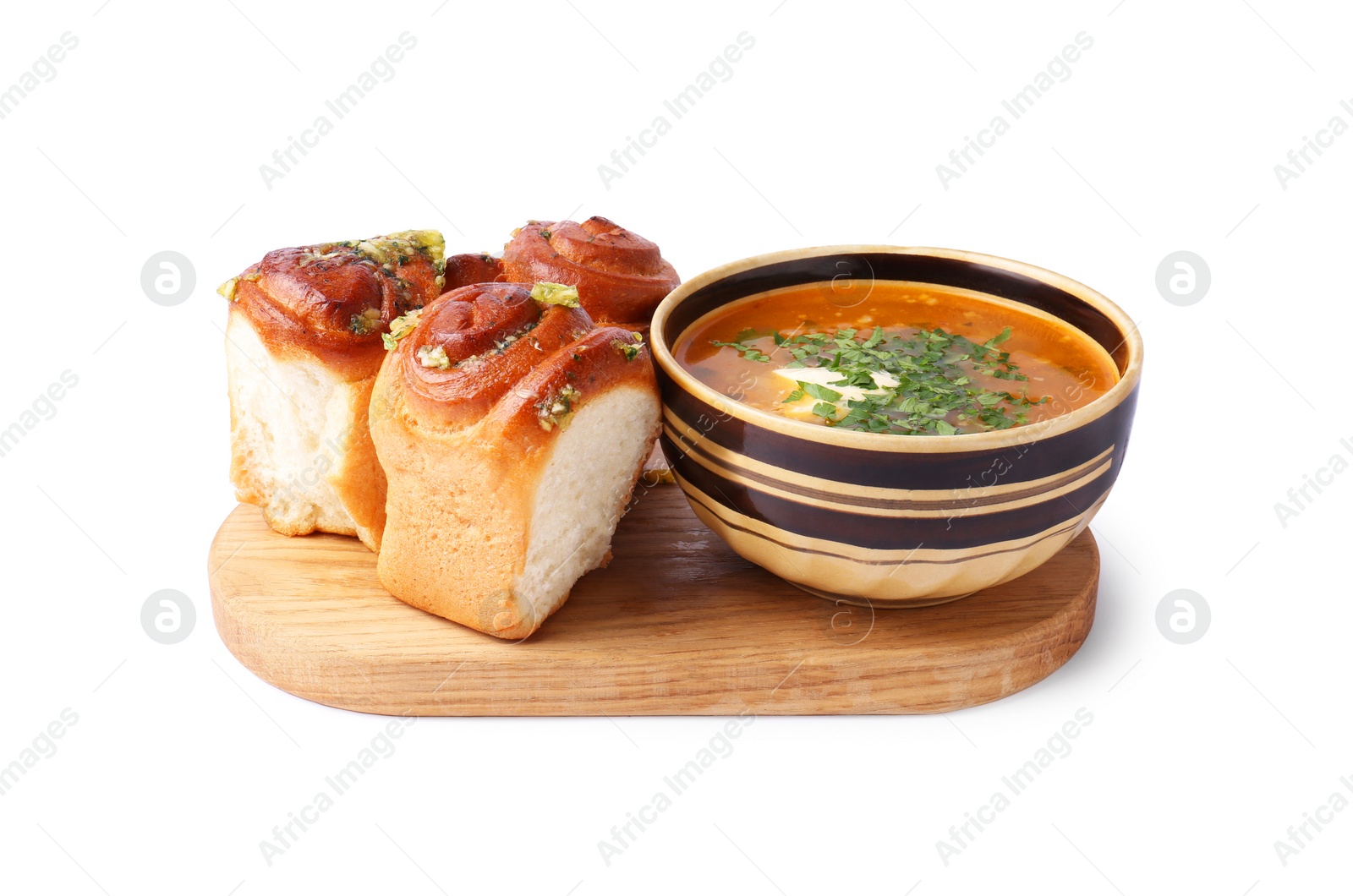 Photo of Tasty fresh pampushky and borsch. Traditional Ukrainian buns with garlic and beet soup isolated on white