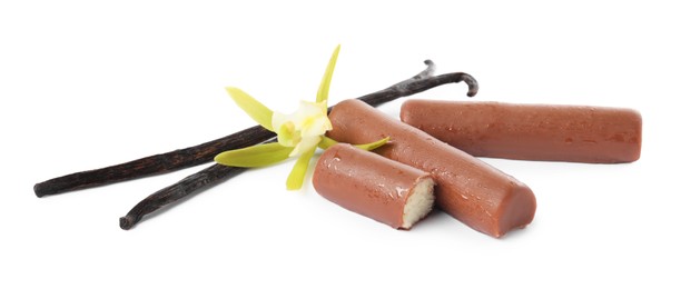 Glazed curd cheese bars, vanilla pods and flower isolated on white