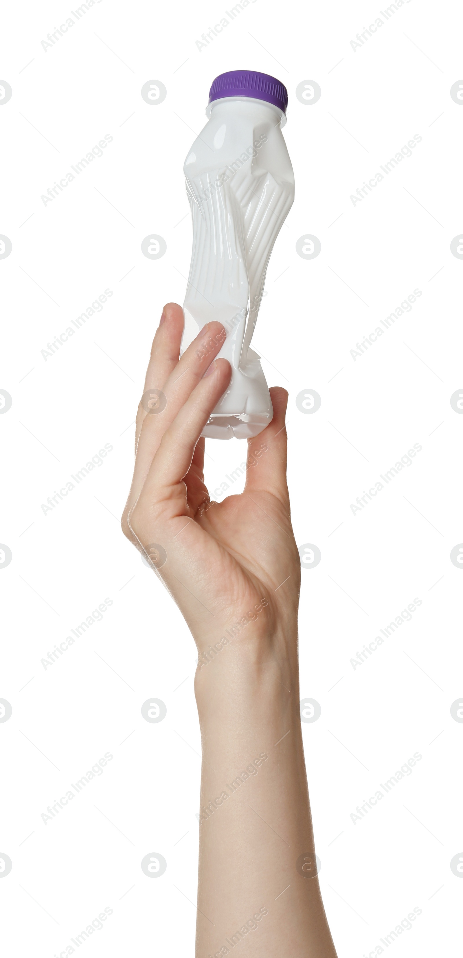 Photo of Woman holding crumpled plastic bottle on white background, closeup