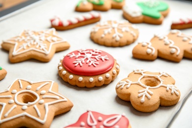 Photo of Tasty colorful Christmas cookies on baking tray