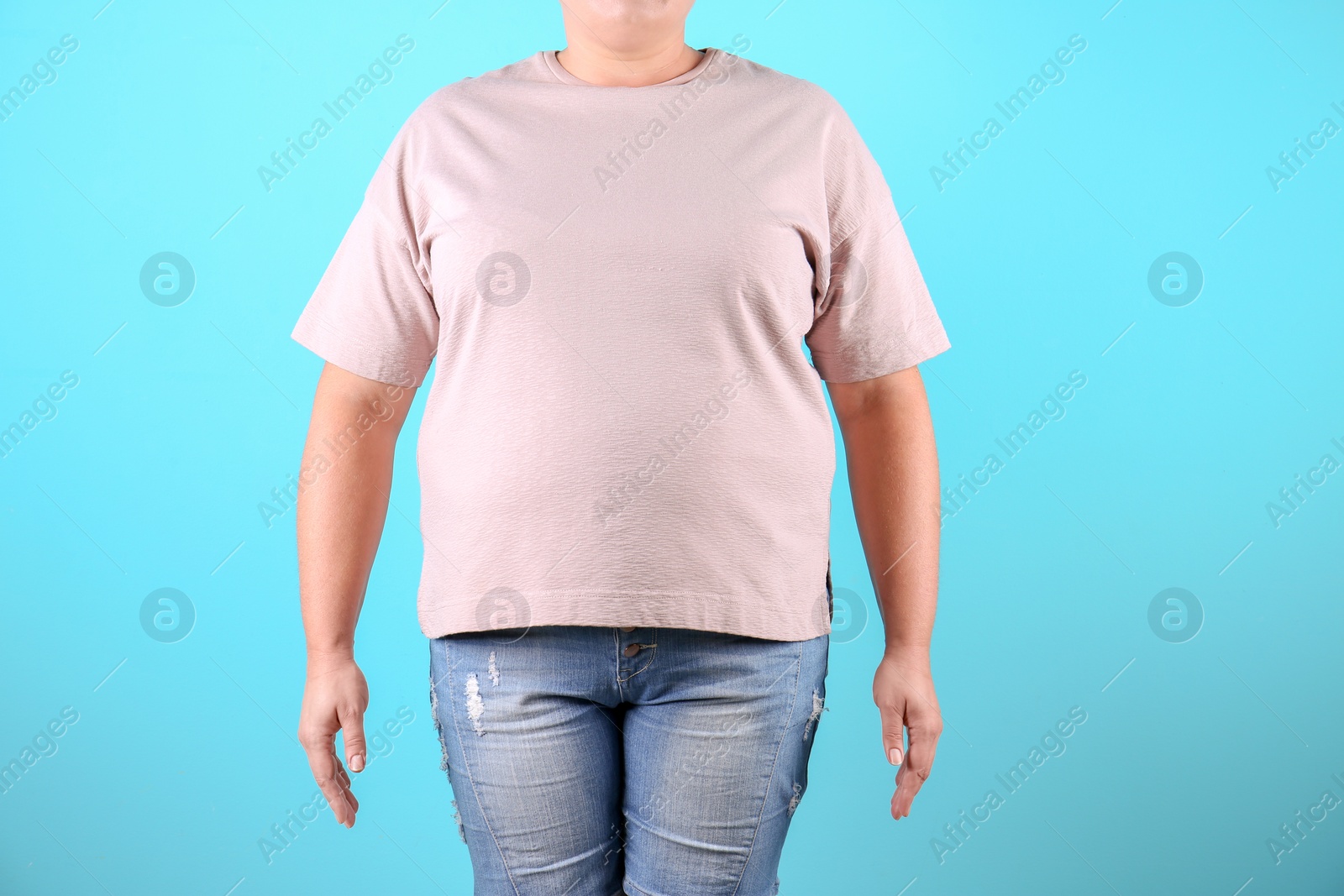 Photo of Fat woman on color background, closeup. Weight loss