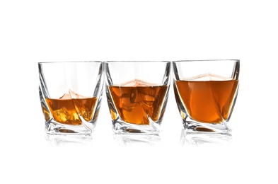 Glasses of scotch whiskey on white background, space for text