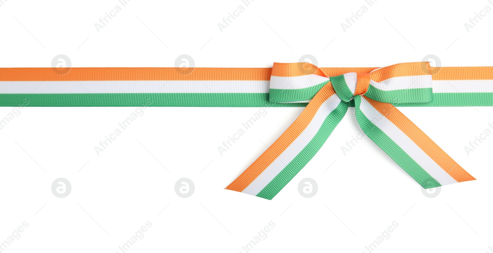 Photo of Indian flag ribbon with bow on white background, top view