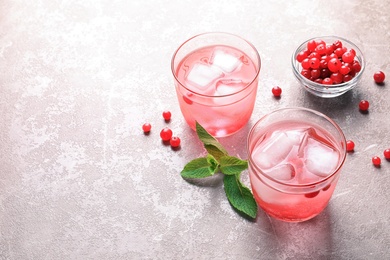 Refreshing natural lemonade in glasses on table