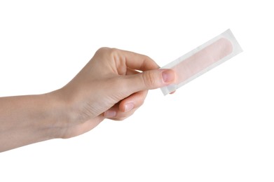 Photo of Woman holding medical adhesive bandage isolated on white, closeup