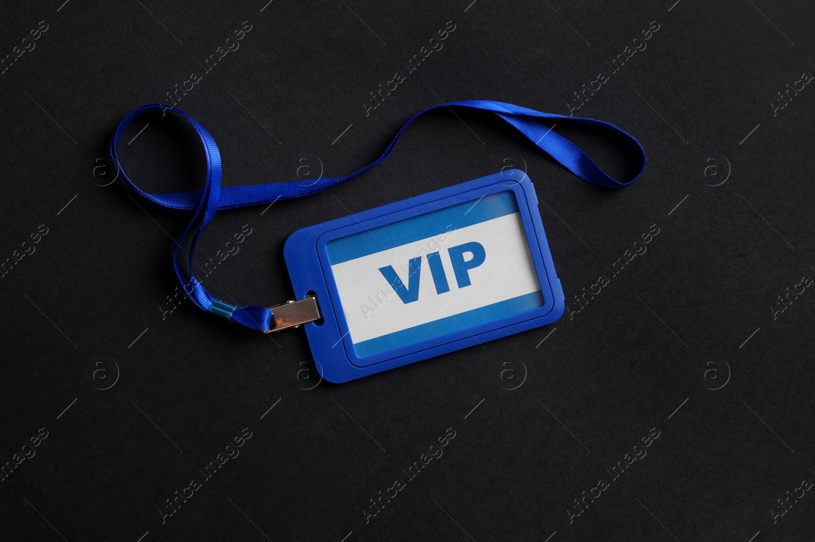 Photo of Plastic vip badge on black background, top view