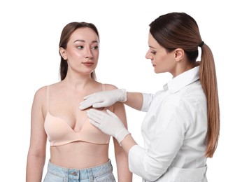 Photo of Mammologist checking woman's breast on white background