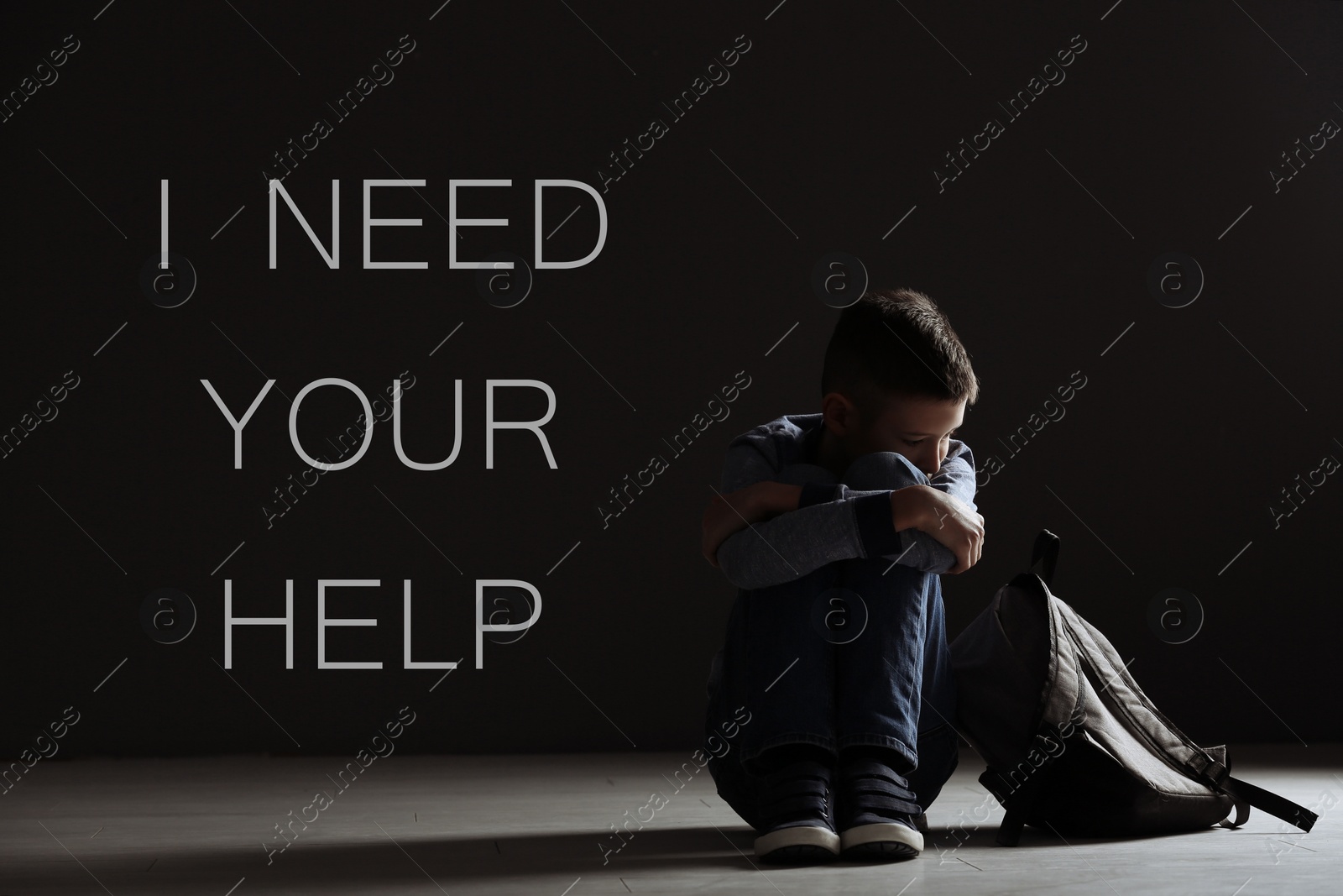 Image of Upset boy with backpack in dark room and text I NEED YOUR HELP