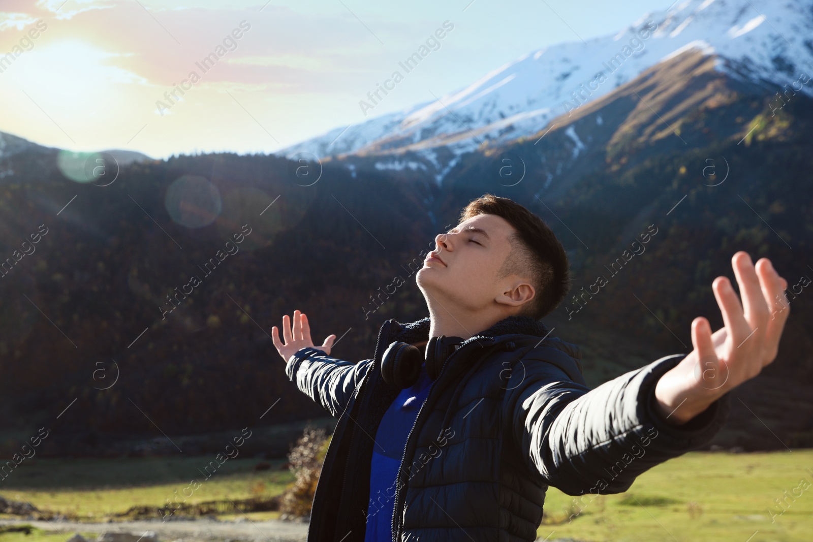 Photo of Boy in beautiful mountains on sunny day