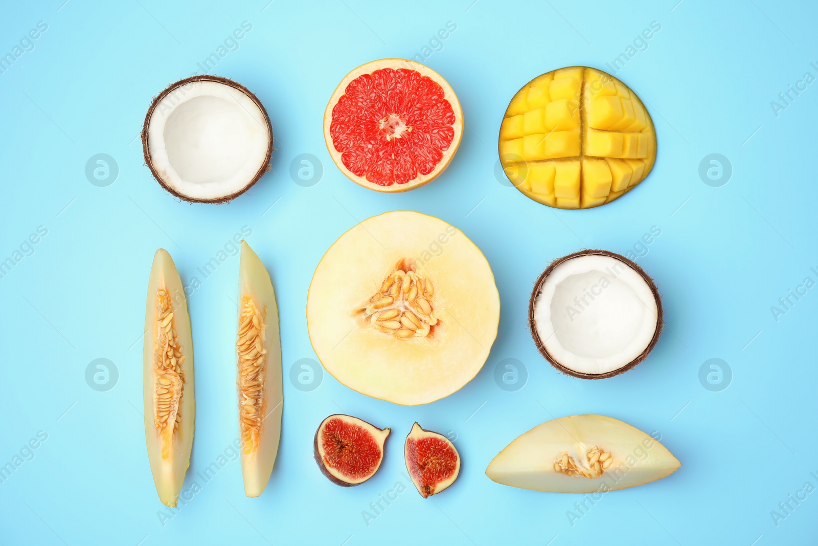 Photo of Flat lay composition with melon and other fruits on color background