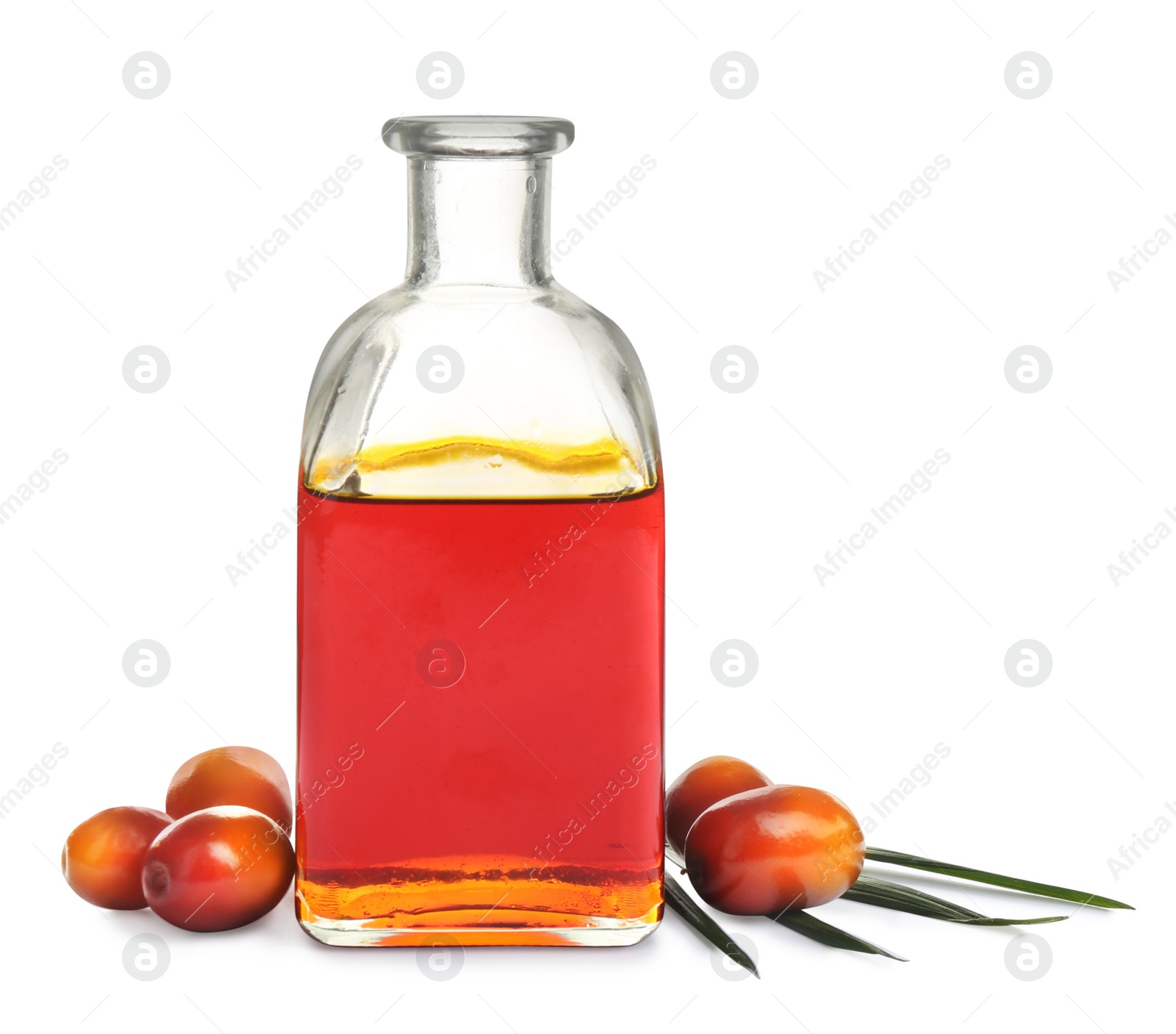 Image of Palm oil in glass bottle and fruits on white background