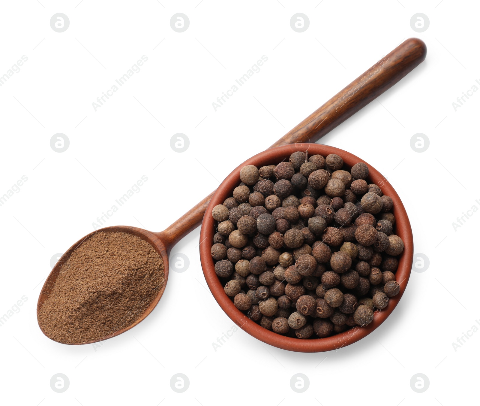 Photo of Aromatic ground pepper allspice, grains and spoon isolated on white, top view