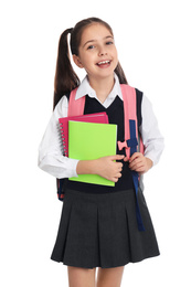 Photo of Little girl in uniform with school stationery on white background