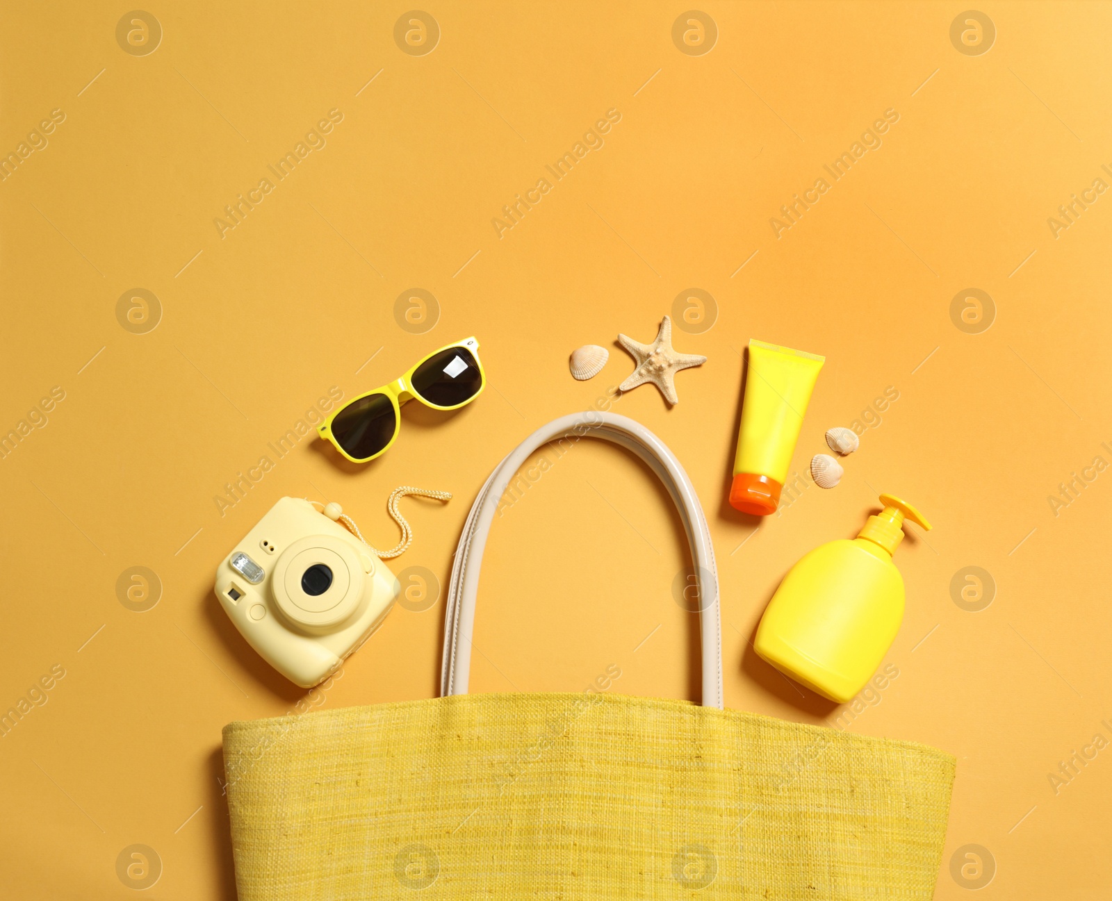 Photo of Flat lay composition with beach accessories on color background