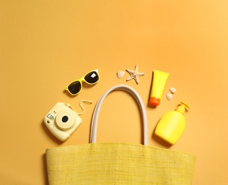 Flat lay composition with beach accessories on color background