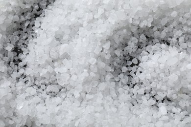 Photo of White natural salt as background, top view