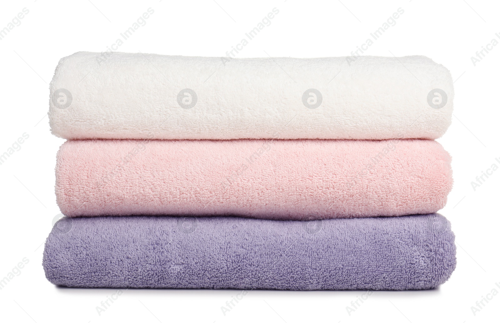 Photo of Folded soft terry towels on white background