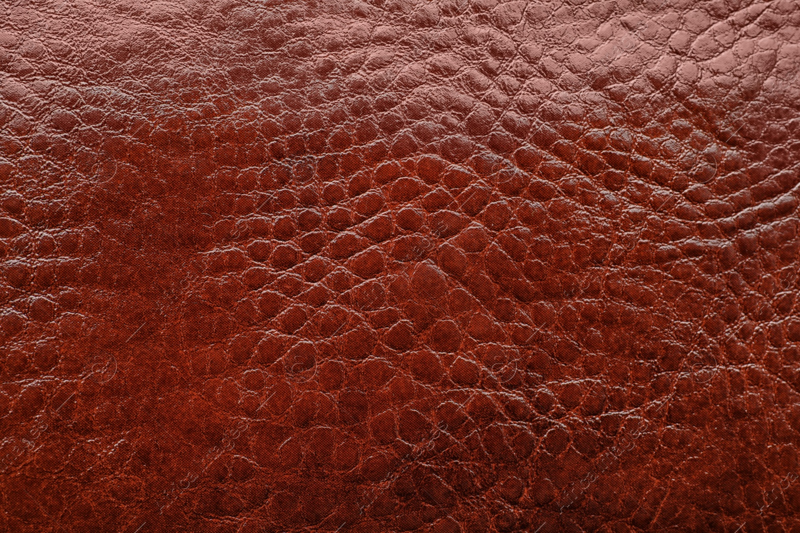 Photo of Texture of brown leather as background, closeup