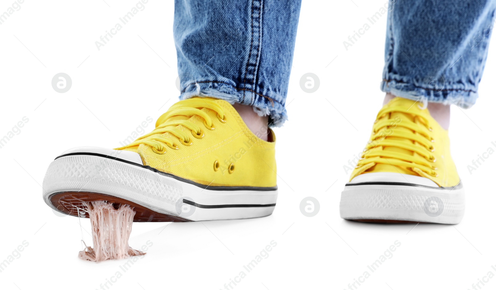 Photo of Person stepping into chewing gum on white background, closeup