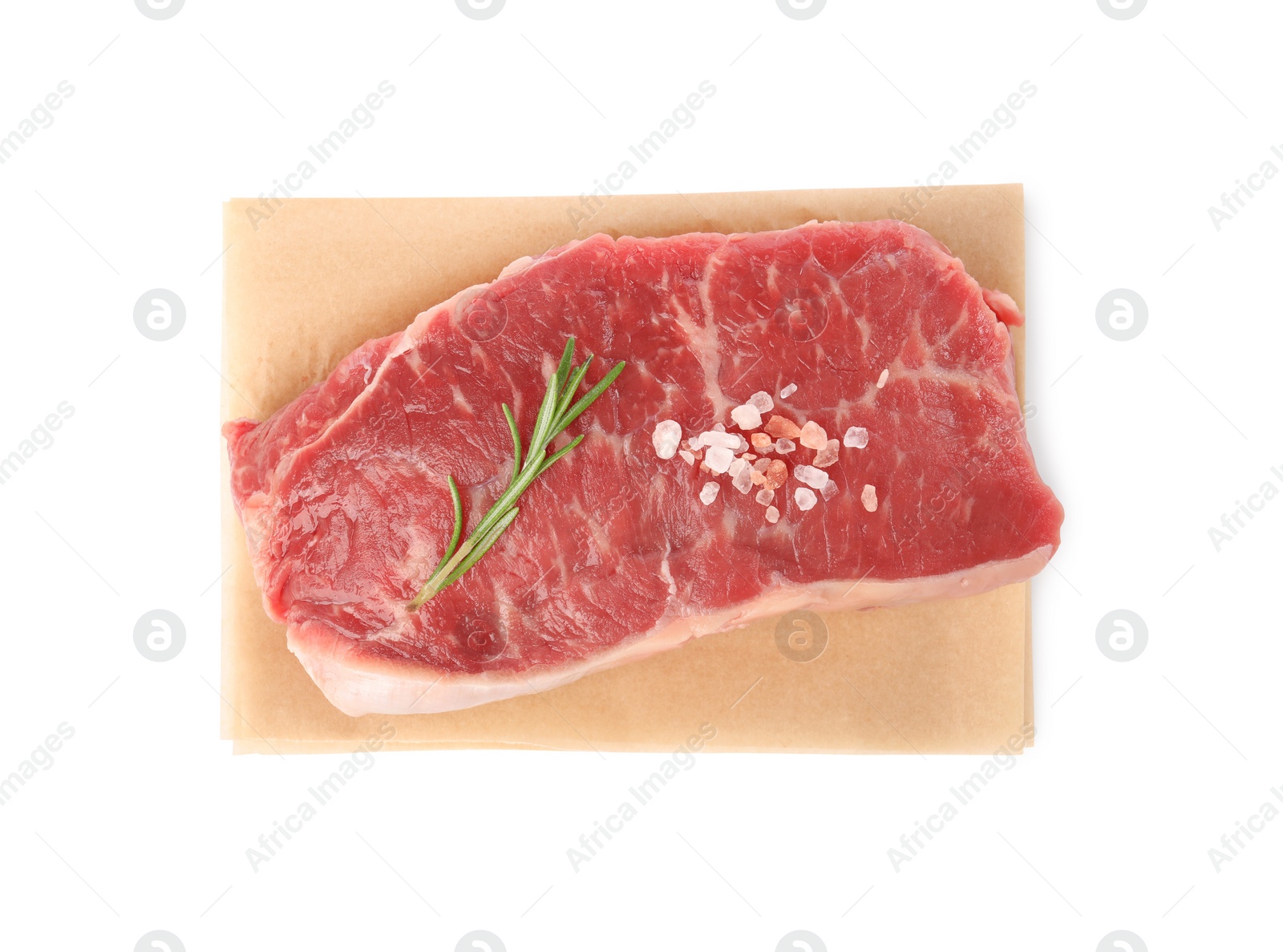 Photo of Steak of raw beef meat and spices isolated on white, top view