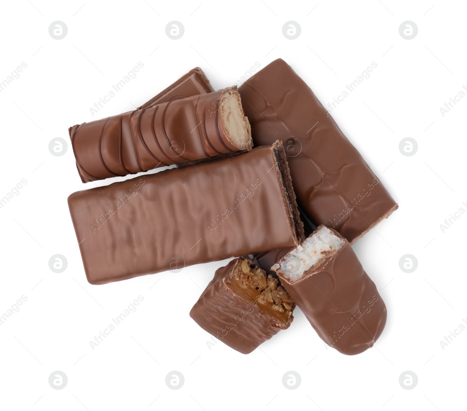 Photo of Pieces of different tasty chocolate bars on white background, top view