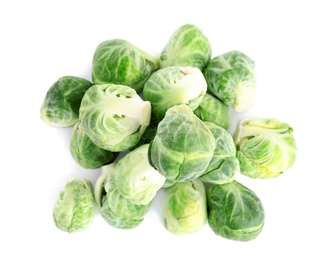 Photo of Pile of fresh Brussels sprouts isolated on white, top view