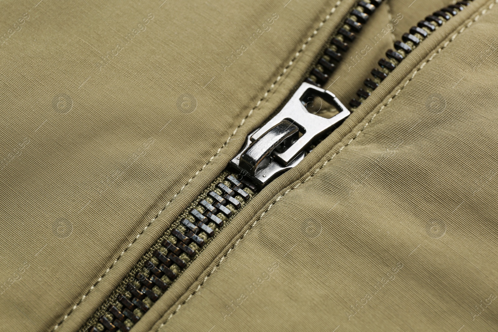 Photo of Grey jacket with zipper as background, closeup view