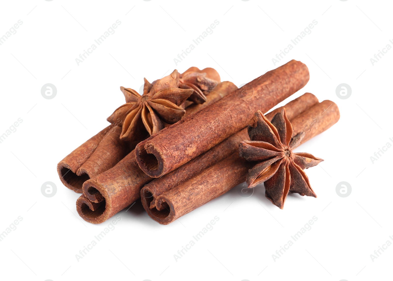 Photo of Cinnamon sticks and anise stars isolated on white