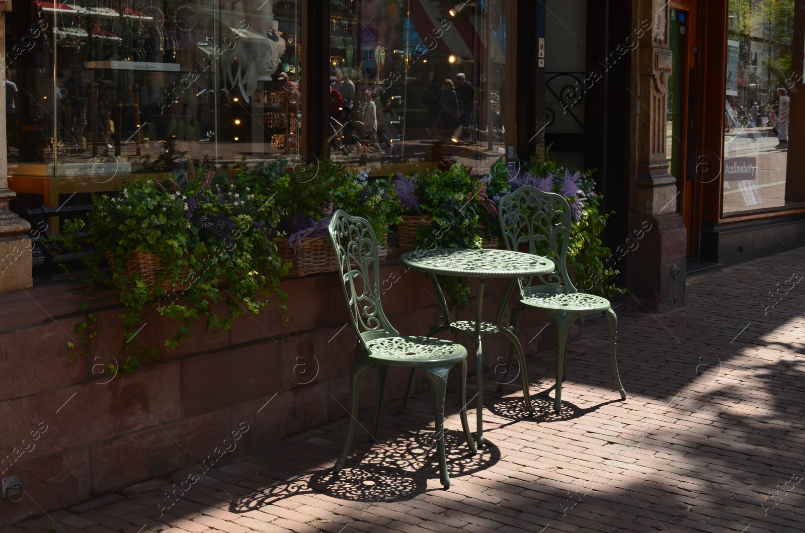 Photo of Chairs and table on terrace near cafe