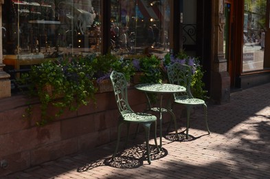 Chairs and table on terrace near cafe