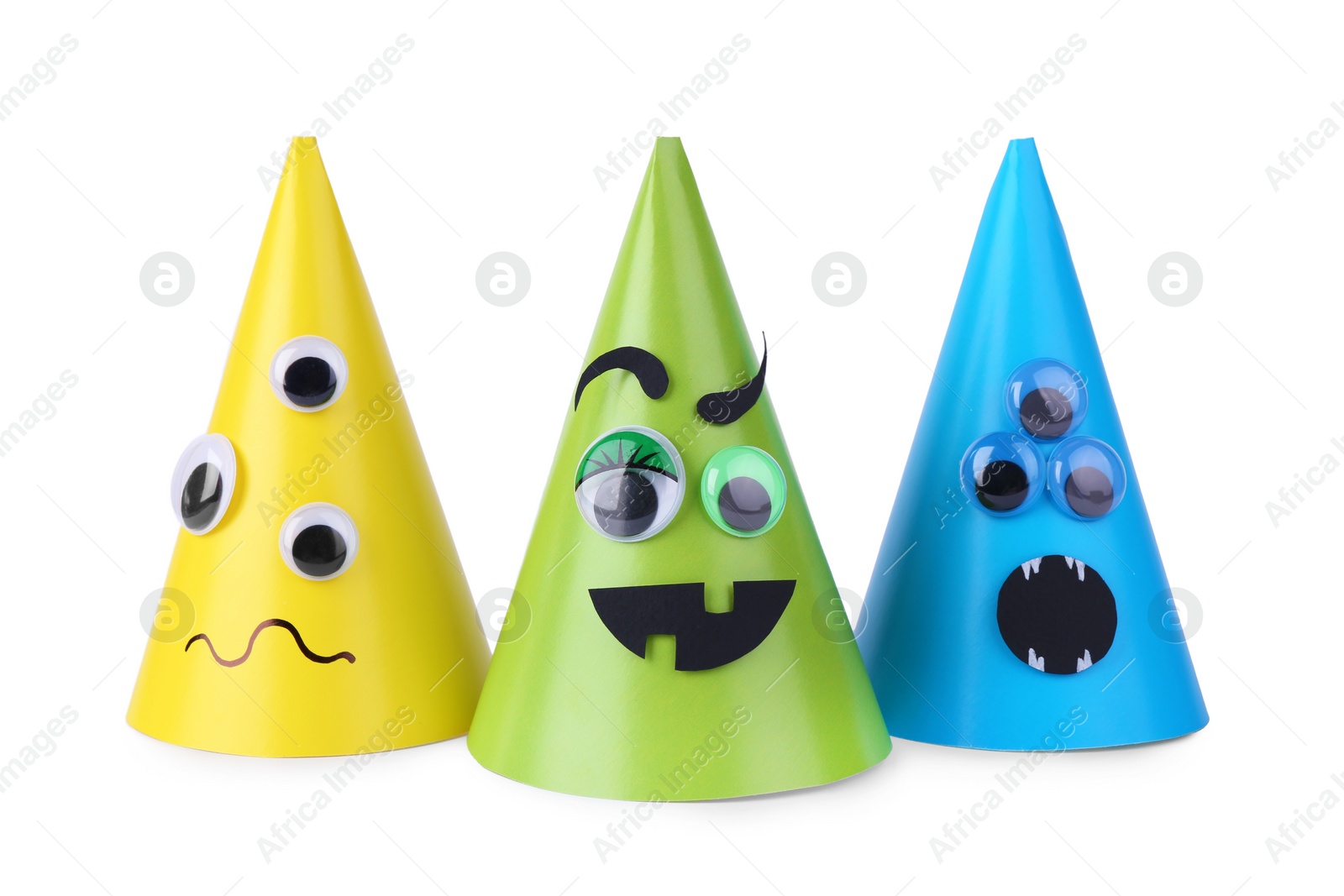 Photo of Funny handmade monsters isolated on white. Halloween decoration
