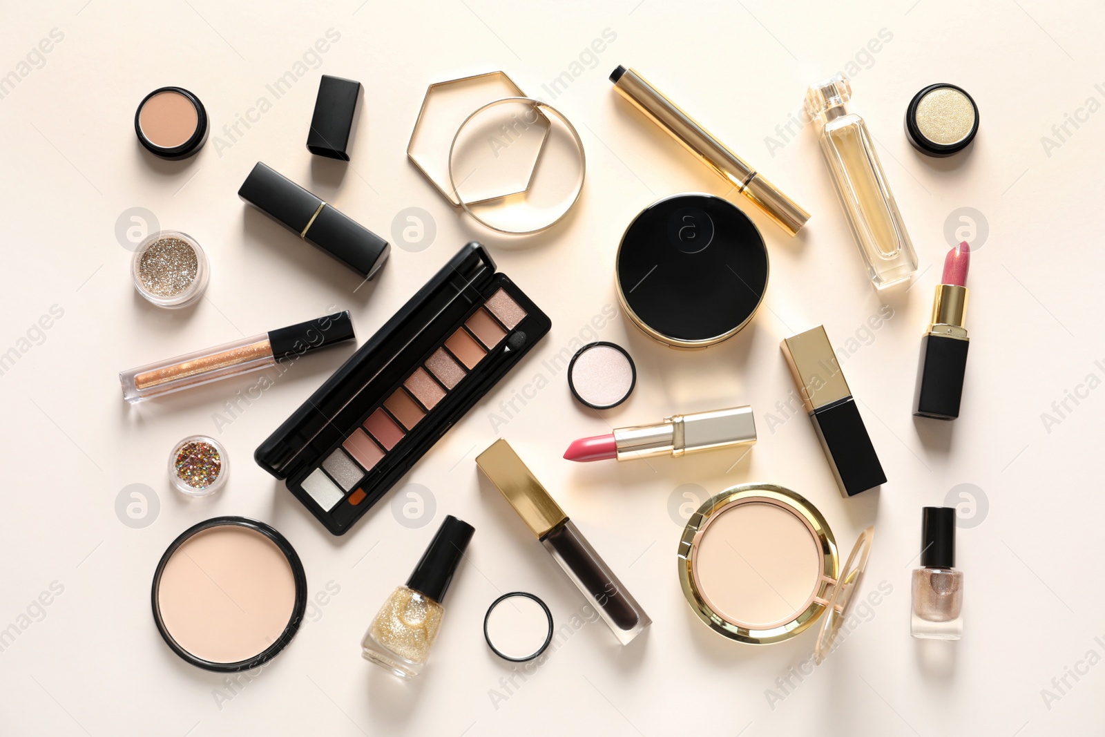 Photo of Set of luxury makeup products on color background, flat lay