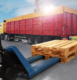 Image of Modern manual forklift with wooden pallets near truck outdoors on sunny day