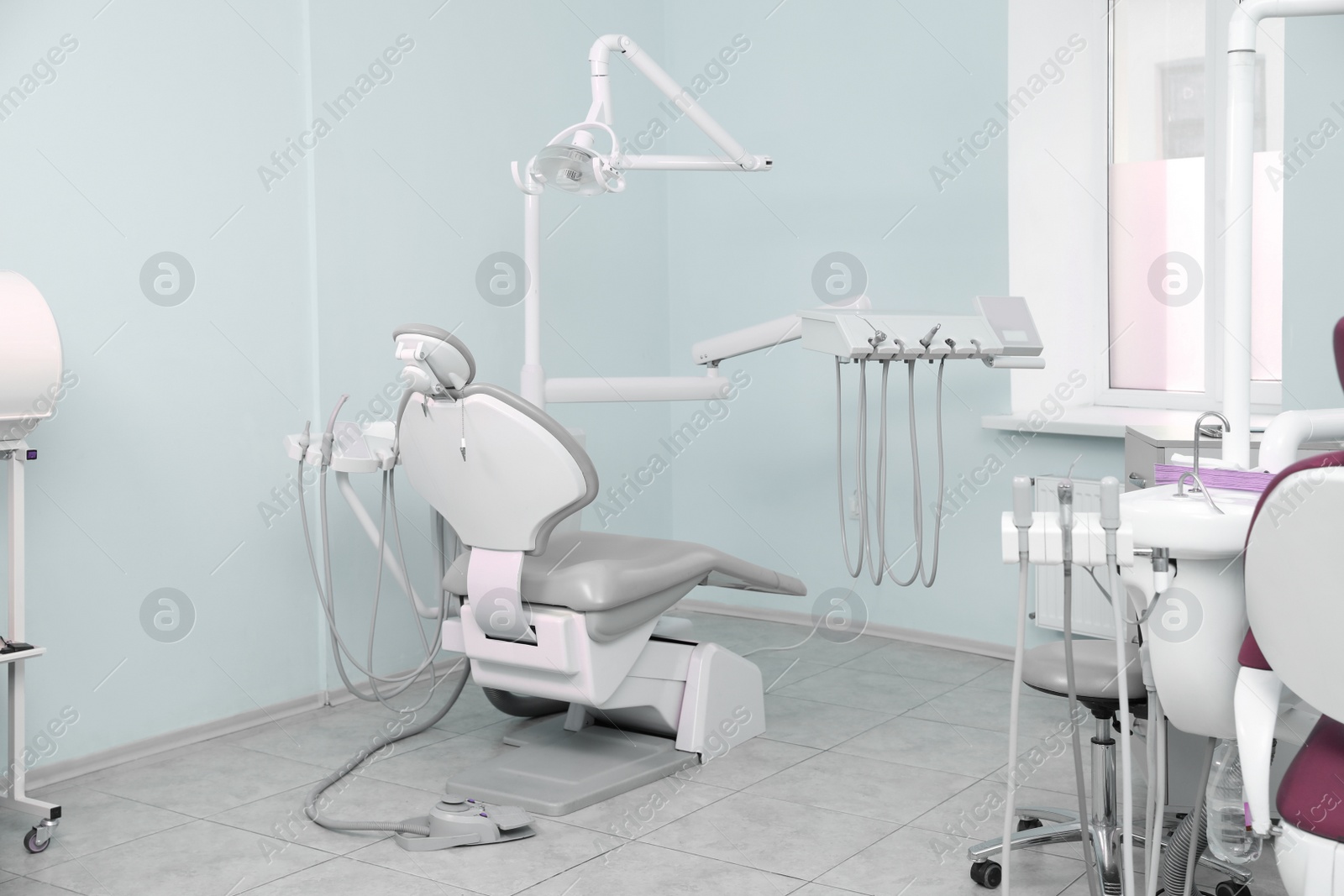 Photo of Dentist's office with modern chair and professional equipment