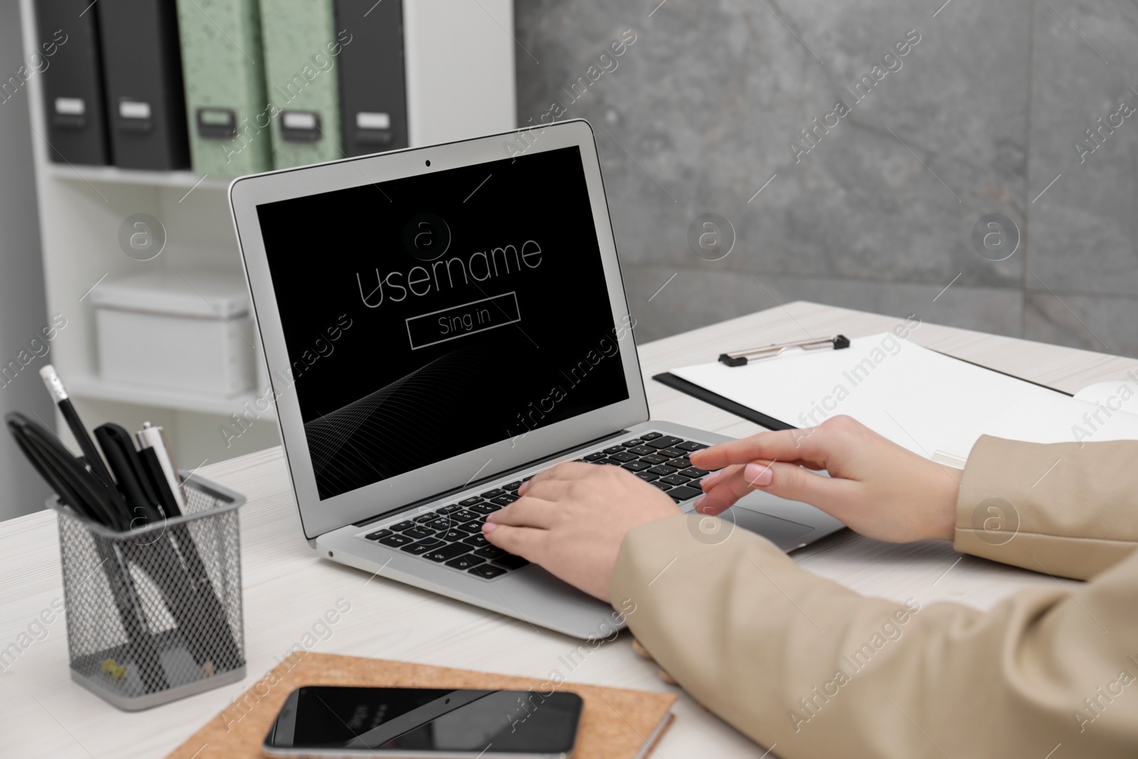 Photo of Woman unlocking laptop with blocked screen indoors, closeup