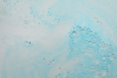 Photo of Foam after dissolving bath bomb in water, closeup