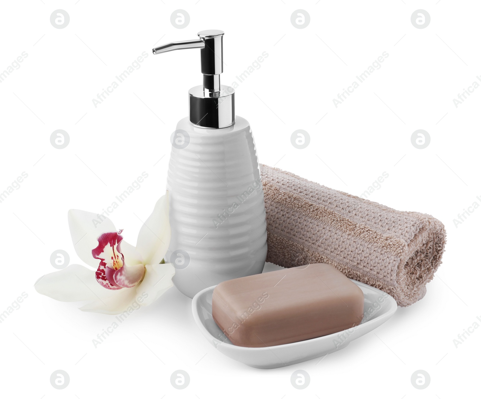 Photo of Soap bar, dispenser and terry towel on white background