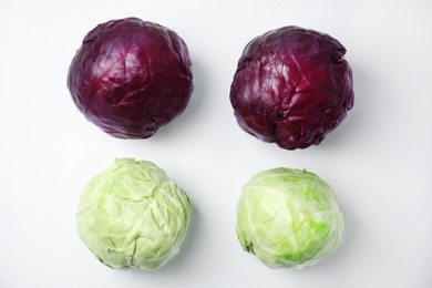 Flat lay composition with ripe cabbages on white background