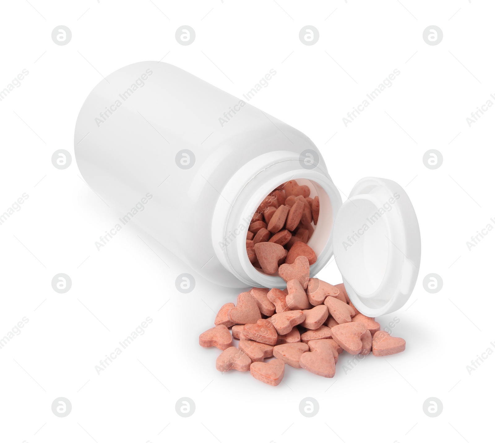 Photo of Bottle and heart shaped vitamins for pets isolated on white