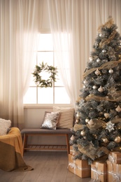 Photo of Beautiful interior of living room with decorated Christmas tree