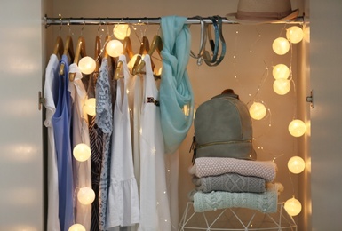 Photo of Women clothing on hangers in wardrobe