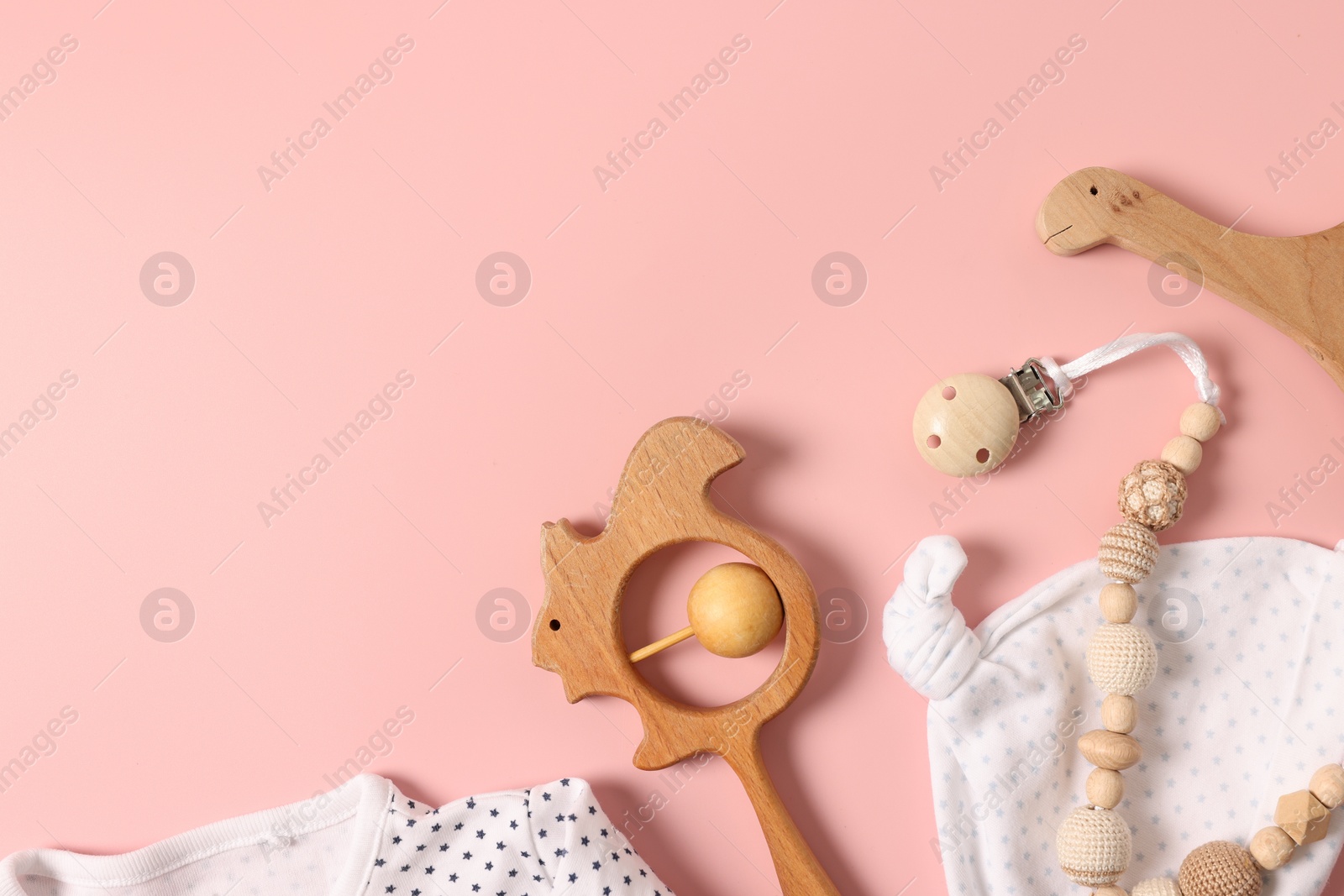 Photo of Different baby accessories on pink background, flat lay. Space for text