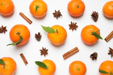 Photo of Christmas composition with tangerines on white background, flat lay
