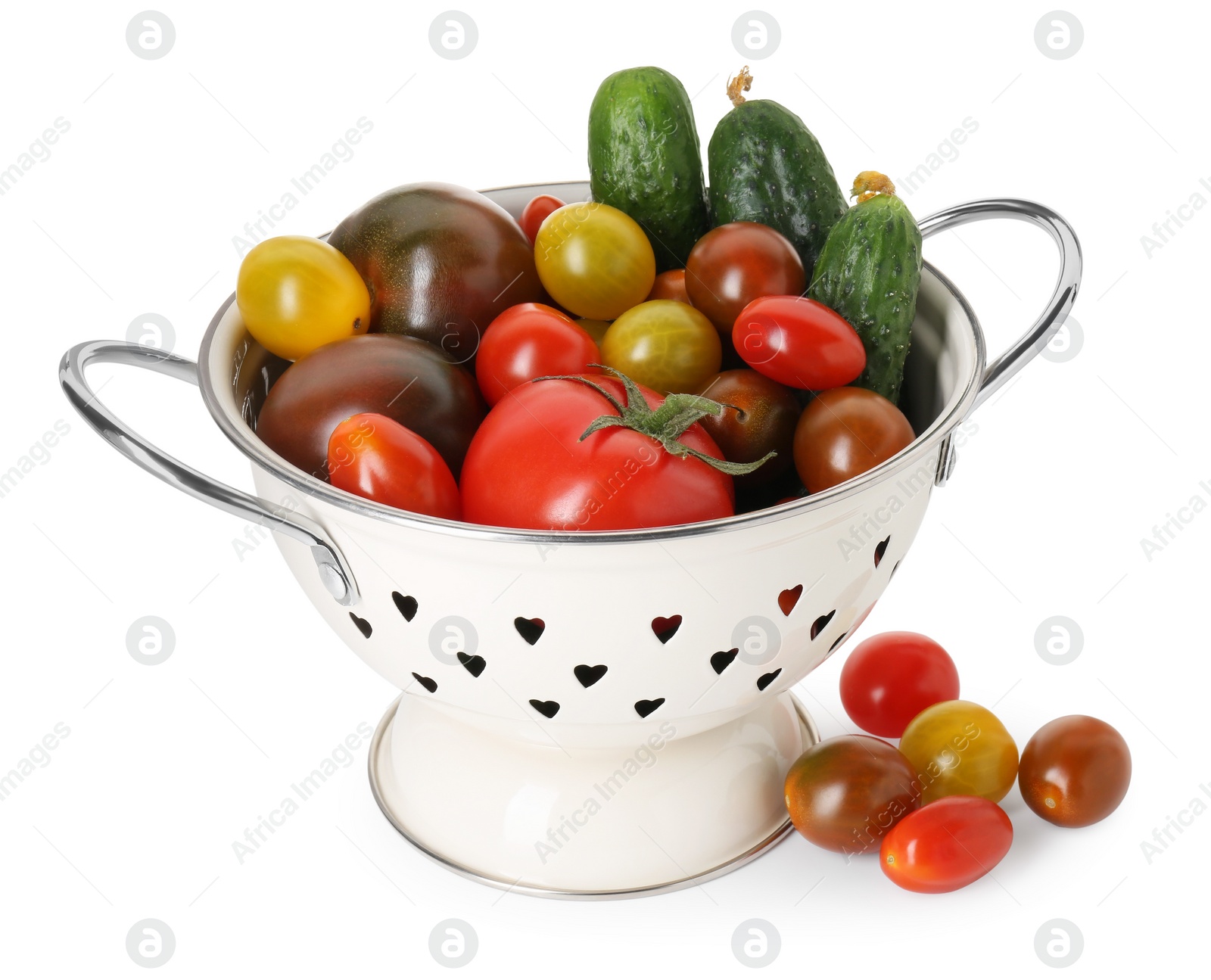 Photo of Metal colander with different tomatoes and cucumbers isolated on white