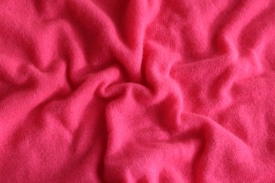 Beautiful pink fabric as background, top view