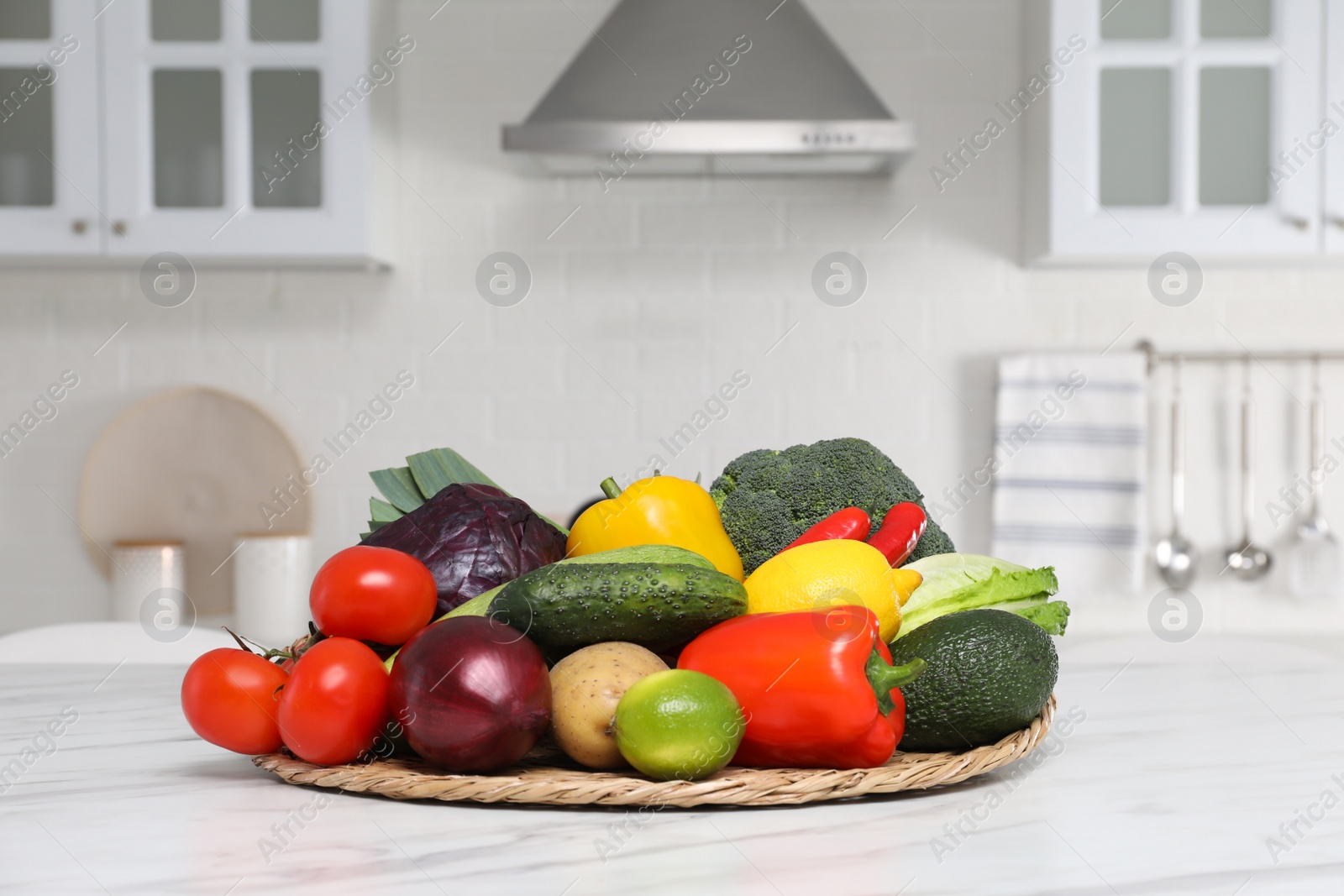Photo of Pile of fresh ripe vegetables and fruits on table in kitchen