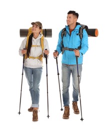 Couple of hikers with backpacks and trekking poles on white background