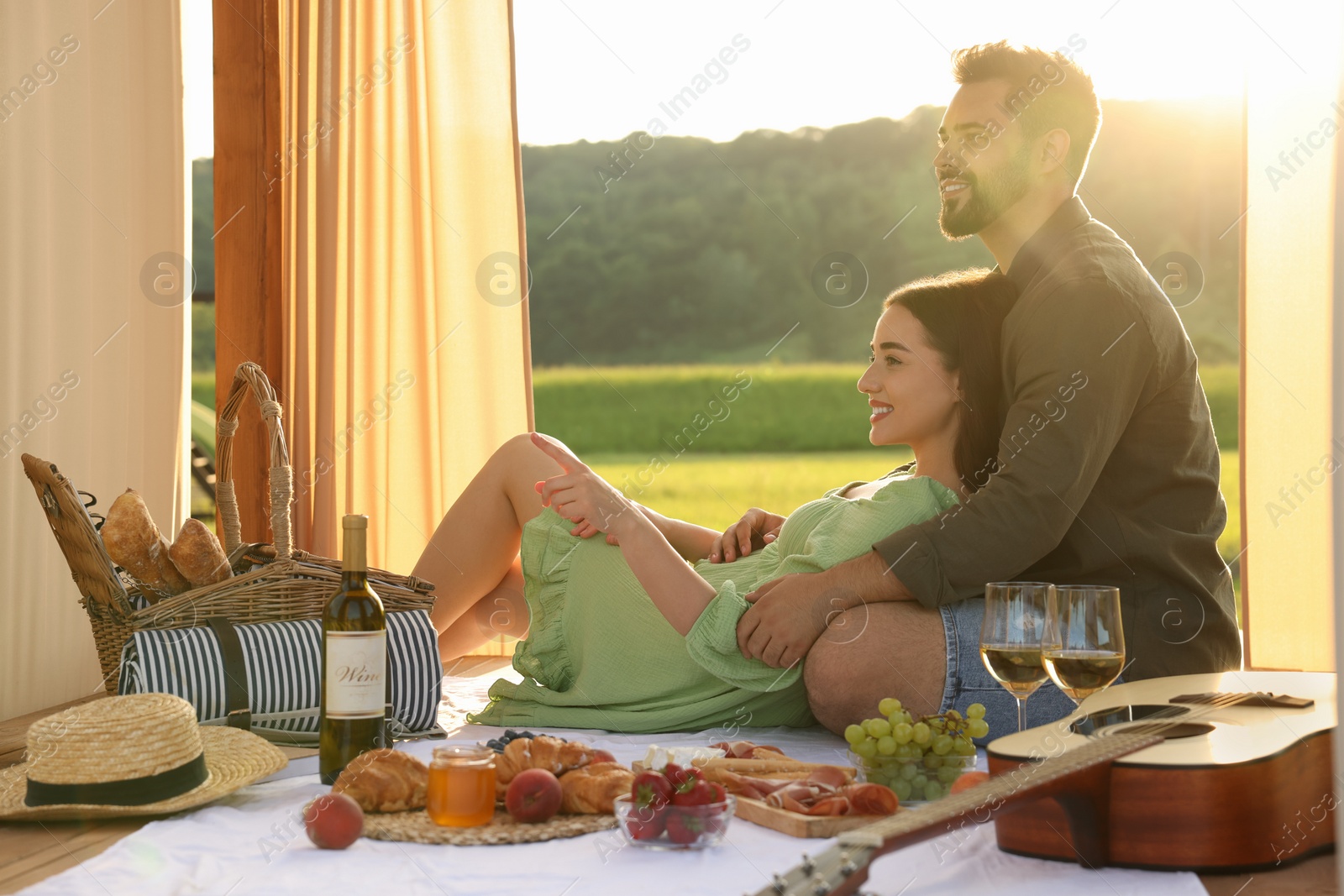 Photo of Romantic date. Couple spending time together during picnic on sunny day