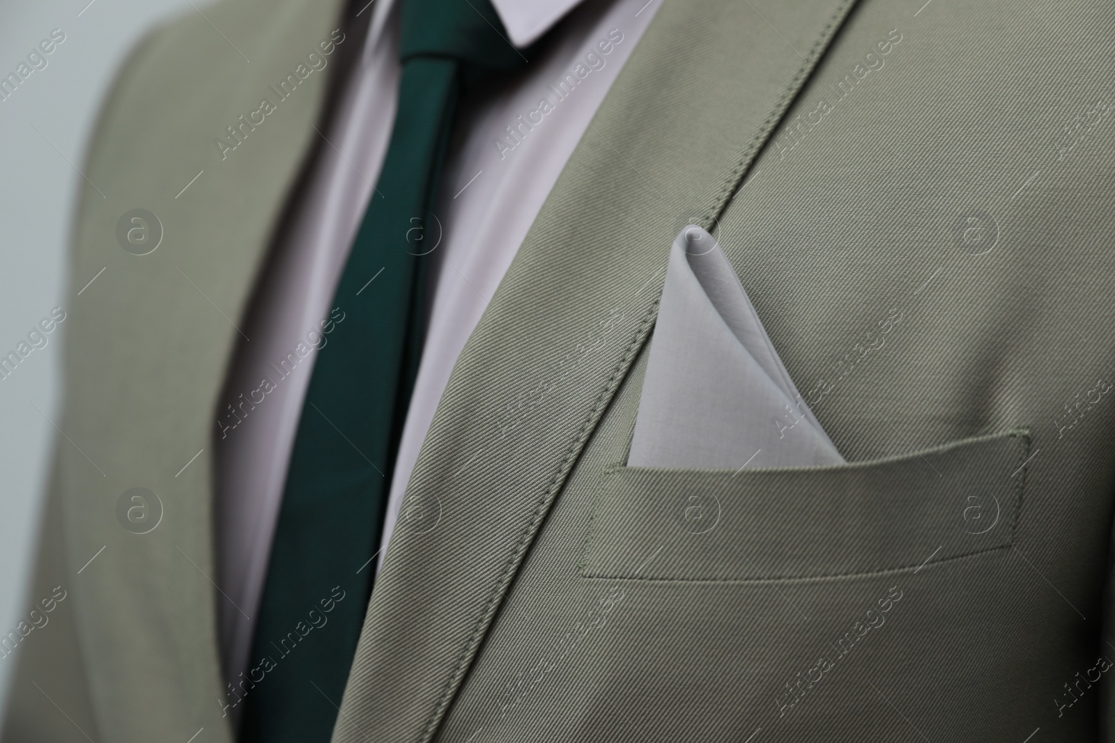 Photo of Man with handkerchief in suit pocket, closeup view