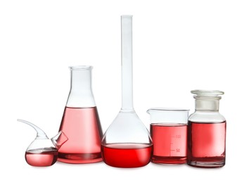 Laboratory glassware with red liquid isolated on white